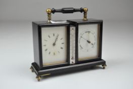 An early 20th century Aneroid clock/thermometer/barometer,