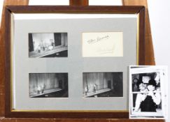 A small sheet with ink signatures reading 'Stan Laurel' and 'Oliver Hardy' (authenticity
