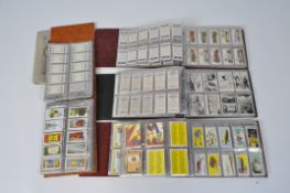 Four albums of collectable cards, from cigarettes and condiments,
