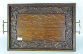 A late 19th/early 20th century oak serving tray, of rectangular form,