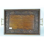 A late 19th/early 20th century oak serving tray, of rectangular form,
