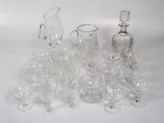 A collection of cut glass drinking glasses of different sizes