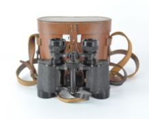 A pair of vintage 8 x 30 binoculars, marked 'Sir John Bennett',