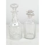 Two moulded glass decanters, both with stoppers, one on a circular base,