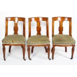 A set of three Victorian oak dining chairs, by Bartholomew & Co,