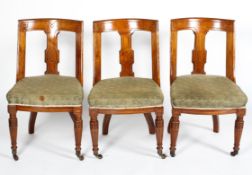 A set of three Victorian oak dining chairs, by Bartholomew & Co,