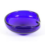 An Elsa Peretti for Tiffany blue glass ashtray, of shaped circular form with turnover rim,