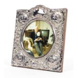 A sterling silver picture frame with raised decoration. by Ray Hall Sheffield 1990. 15cm x 15cm.