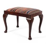 A Georgian style mahogany stool, of rectangular form with cabriole legs and striped seat,