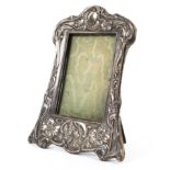 A sterling silver picture frame with Art nouveau style decoration by Samuel M Levy Birmingham 1910