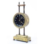 A late 19th/early 20th century pillar gravity mantel clock, weight driven movement,