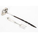 A coin set white metal toddy ladle with turned handle together with a sterling silver toasting fork