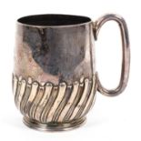 A sterling silver mug with half reeded design by Atkins Brothers Sheffield, 1892. 8.
