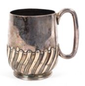 A sterling silver mug with half reeded design by Atkins Brothers Sheffield, 1892. 8.