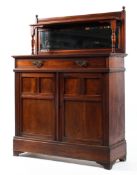 A late Victorian mahogany sideboard, with mirrored back and galleried shelf on baluster supports,