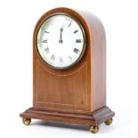 A dome topped Edwardian style string inlaid mahogany mantel clock. H:21cm.