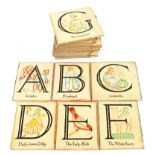 A collection of early 20th century painted wood nursery alphabet plaques,