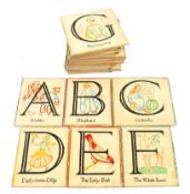 A collection of early 20th century painted wood nursery alphabet plaques,