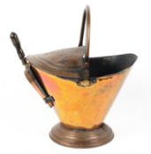A Victorian copper coal scuttle and shovel, late 19th century, of tapering form,