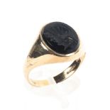 A yellow metal signet ring set with a seal engraved onyx. Hallmarked 9ct gold, Size P
