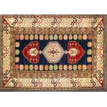 A Kelim style wool rug with geometric borders, 190cm x 127cm.