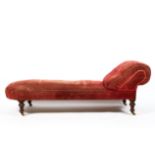 A Victorian chaise longue, late 19th century, with scroll rest, upholstered in red/pink velvet,