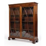 A George III style mahogany glazed bookcase, with two doors with ovolo-shaped astragals,