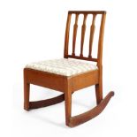 A Victorian mahogany rocking chair, with pierced vase-shaped splats,