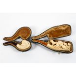 Two carved meerschaum pipes,