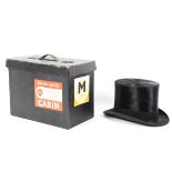 An early 20th century Herbert Johnson black silk top hat, with a silk and leather interior,