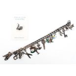 A sterling silver curb link charm bracelet. set with numerous sterling silver charms. 37g.
