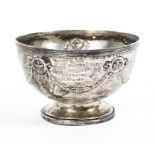 A sterling silver circular footed bowl with swags and garland decoration by Elkington & Co.