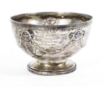 A sterling silver circular footed bowl with swags and garland decoration by Elkington & Co.