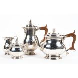 A four piece sterling silver tea set of bulbous form on circular stepped foot.