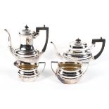 An Edwardian four piece EPNS tea service, in the Georgian style, of reeded form, 20.
