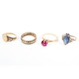 A collection of four rings to include a signet ring, wedding ring and two synthetic gem rings.