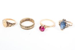 A collection of four rings to include a signet ring, wedding ring and two synthetic gem rings.