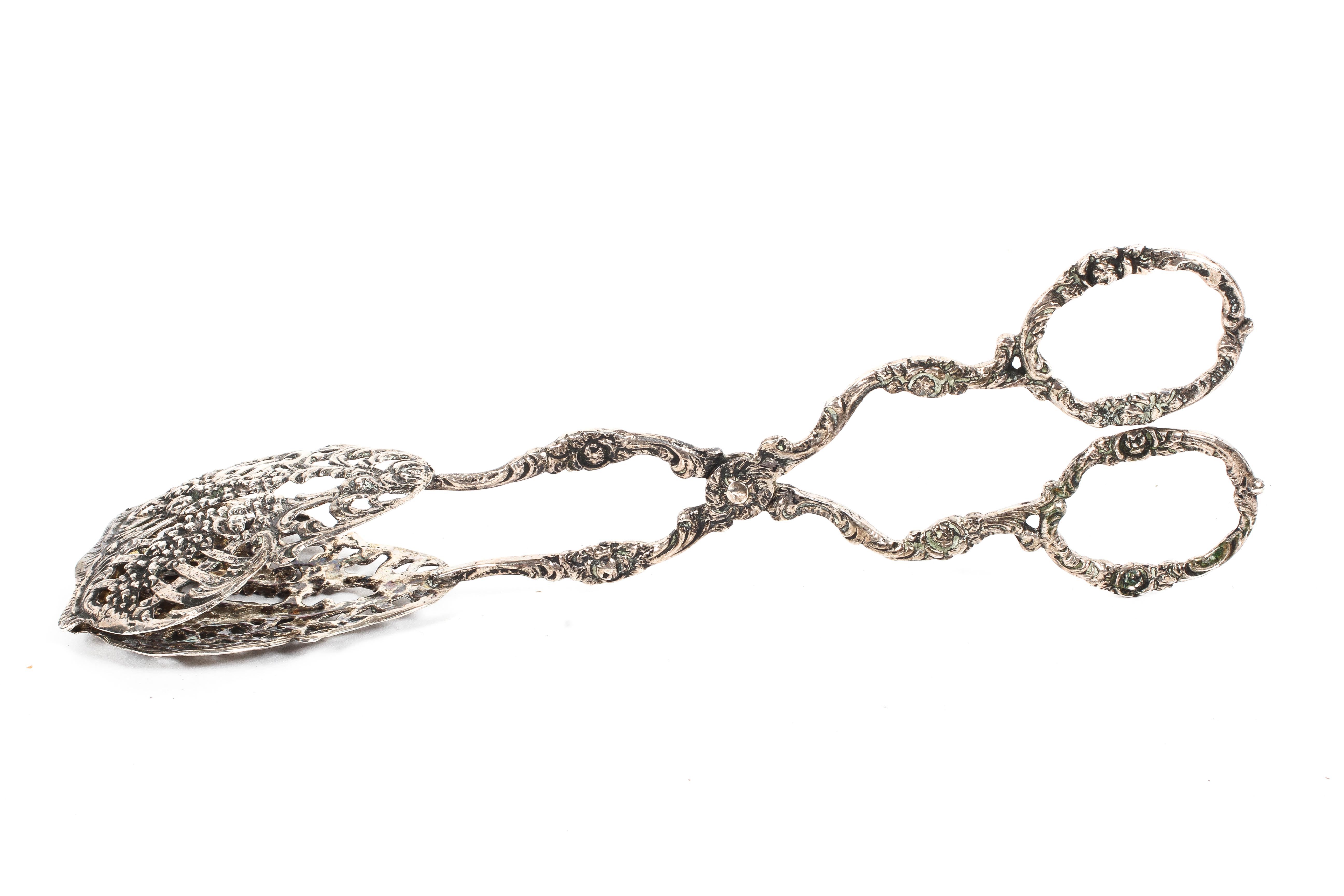 A pair of profusely decorated Swedish white metal tongs 63 g - Image 2 of 2