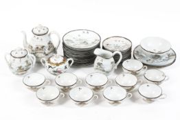 A Japanese eggshell tea service, late 19th century, iron-red marks,