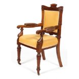 A Victorian mahogany armchair, late 19th century, carved with reeded frame,
