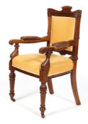 A Victorian mahogany armchair, late 19th century, carved with reeded frame,