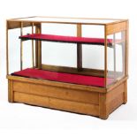 An oak Art Deco glazed display case, circa 1930, of rectangular form, with reeded feet,