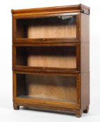 A Globe Wernicke oak three tier glazed bookcase,