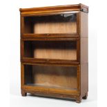 A Globe Wernicke oak three tier glazed bookcase,