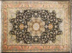 A large Nain style rug black ground with central floral medallion. 304cm x 200cm.