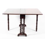A Victorian folding gateleg table on barley twist supports and arched feet,
