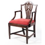 A George IIII mahogany dining chair, with carved oviform splat and arched top rail,