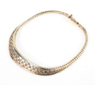 A 9ct tri-coloured gold flat fancy link bracelet, 20cm, 10.9g.