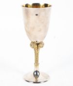 A sterling silver commemorative goblet with gilt Fleur de Lys stem, and gilt interior,