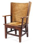 An Orkney oak framed chair, early 20th century, with curved high rush back and drop-in rush seat,